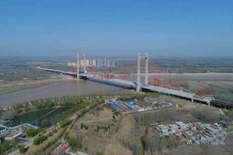華全點贊“黃河第一跨” 發(fā)電機名企的基建情結(jié)